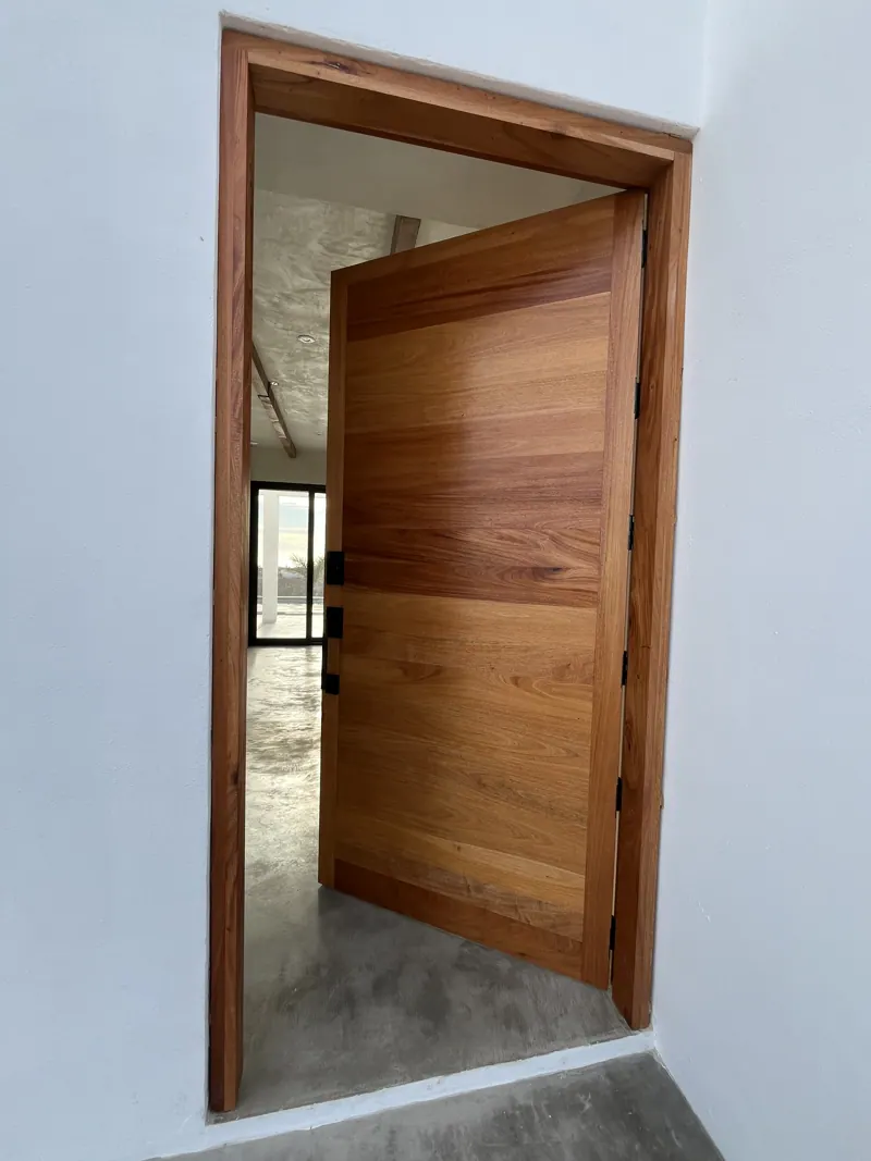 Solid wood pivot entry door, open